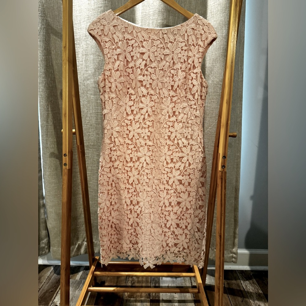 Beautiful fully lined peach dress with zip closure in back.